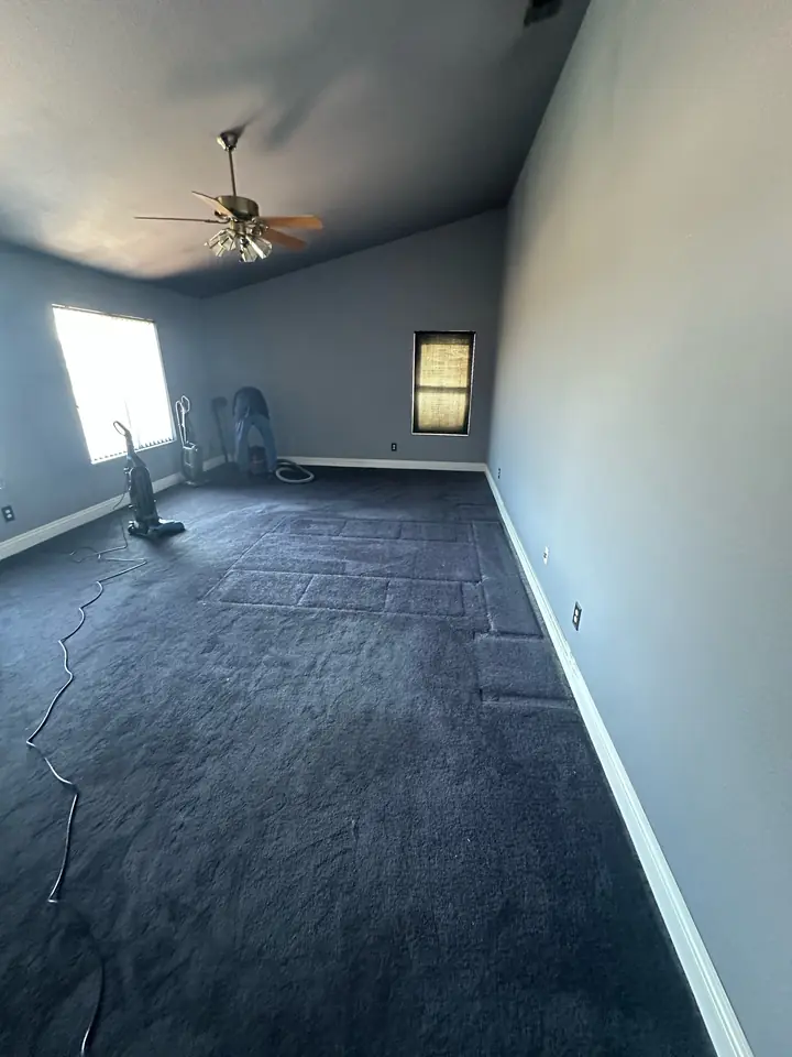 Interior room after large furniture and loose contents were removed